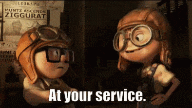 Two children characters wearing hats with goggles and the one kid is saying "at your service" and putting his arm out