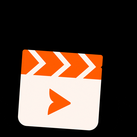 a orange and white clapboard with stars coming out against a black background