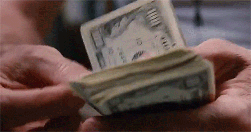 a person counting money for kickstarter video production cost