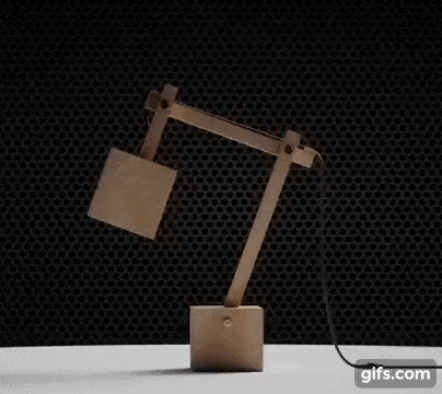 3d product animation services showing a 360 view of a wooden lamp that's lit up